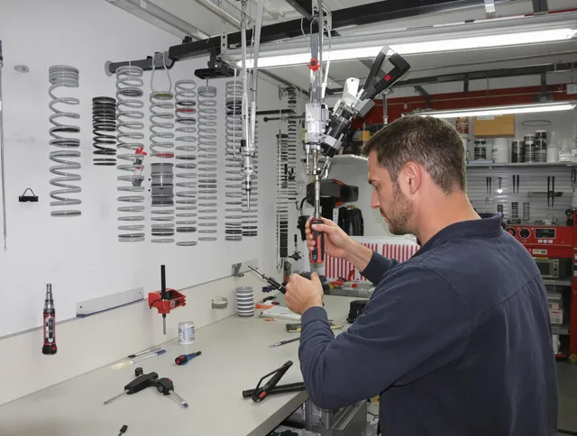 Orange Garage Door Repair safety certified technician performing precision spring replacement in Orange
